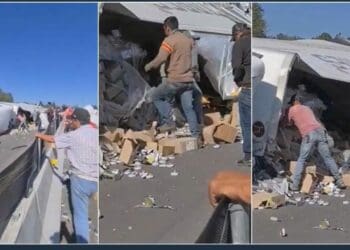El chofer de un tráiler murió tras volcarse su unidad; la gente llegó a la rapiña pero nadie ayudó al lesionado cuando seguía con vida. Foto: Captura de video